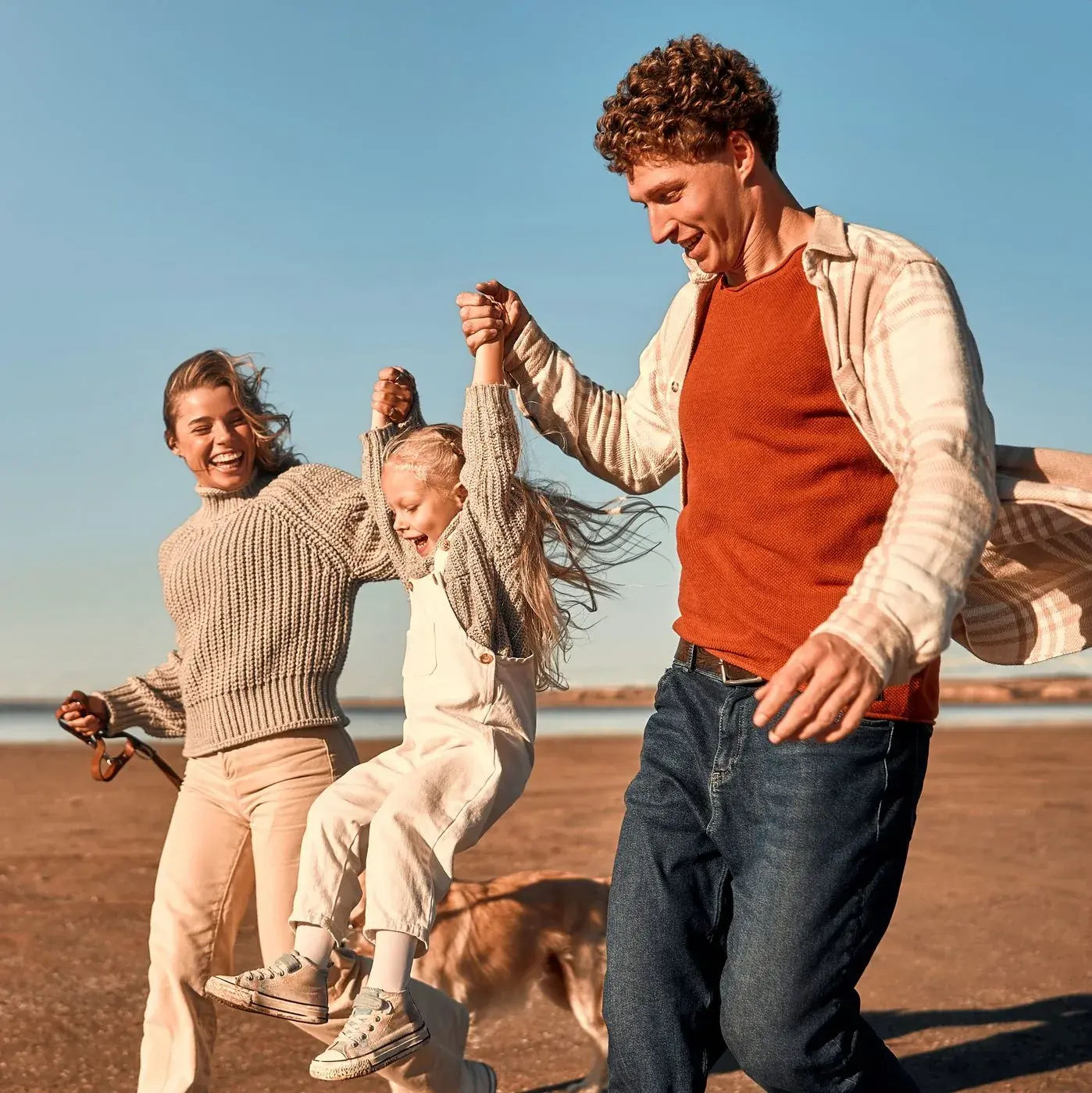 Family laughing together outdoors